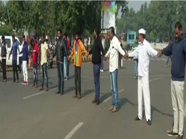 People making human chain in Odisha to support a day a nationwide trade union strike (Photo/ANI)