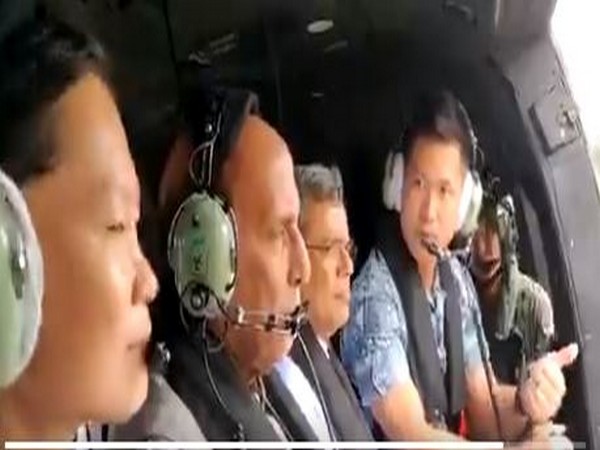 Defence Minister Rajnath Singh (second from right) along with Singapore air officials while taking familiarisation air sortie in Super Puma Helicopter of Republic of Singapore Air Force
