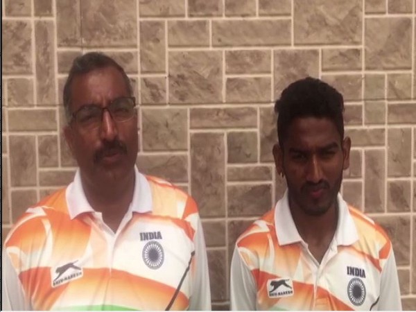 Avinash Sable (R) with coach Amrish Kumar (L)