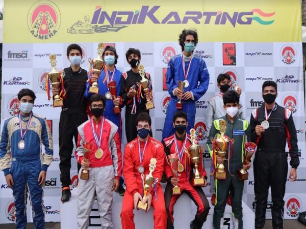 Champions of 'Ajmera Indikarting Clash of Pros' with their winning trophy  
