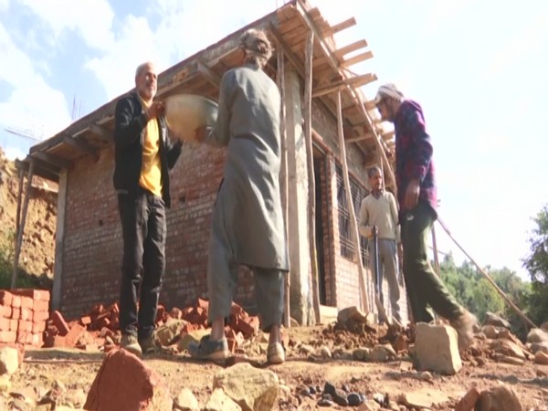 A Community hall work is underway in Upper Thanoa Panchayat in Udhampur district of Jammu and Kashmir (Photo/ANI)