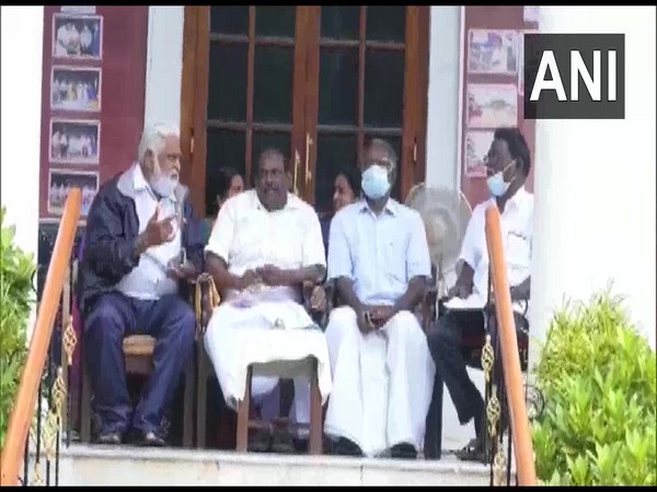 Puducherry Social Welfare Minister M Kandasamy sitting in protest outside the Assembly. (Photo/ANI)