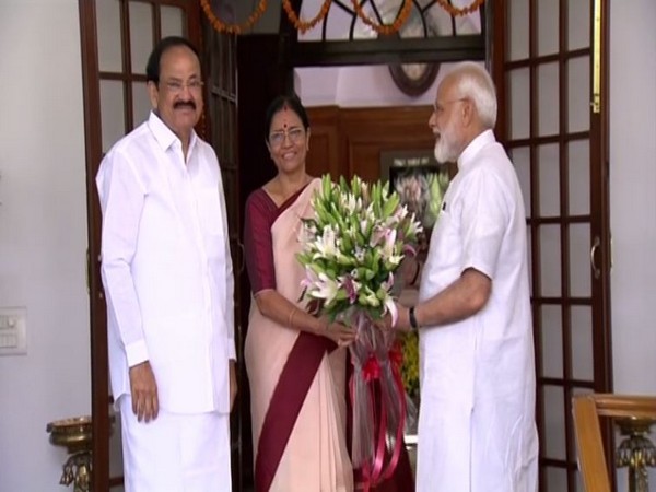 PM Narendra Modi with Vice-President Venkaiah Naidu and his wife M Usha at their official residence in New Delhi on Sunday. Photo/ANI