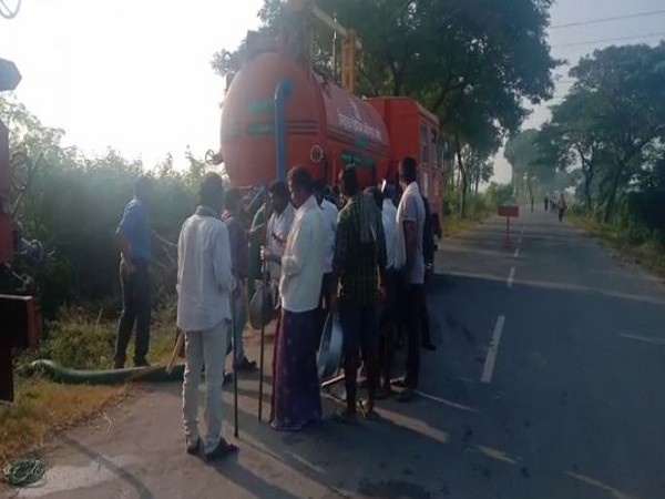Locals gathered at Mullapadu village where petrol is leaking from HPCL pipeline on Wednesday. Photo/ANI