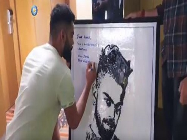 Virat Kohli with his portrait (Photo/ BCCI Twitter)
