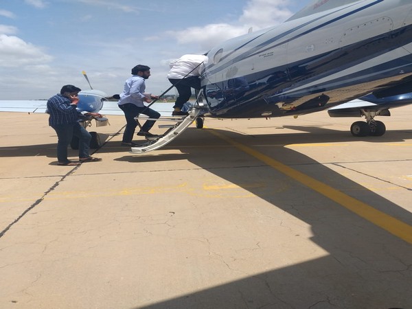 BS Yeddyurappa's PA Santosh was seen escorting rebel Congress leaders at the airport. Photo/ANI