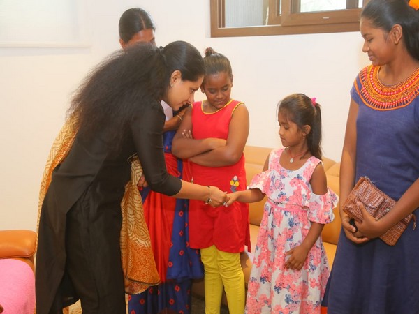 Telangana MLC Kavitha Kalvakuntla with the family of the victim. (Photo/ANI)