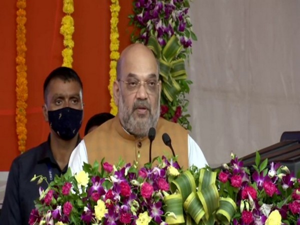 Union Minister Amit Shah addressing at the inauguration of the City Civic Centre at South Bopal in Gujarat's Ahmedabad on Sunday. [Photo/ANI]