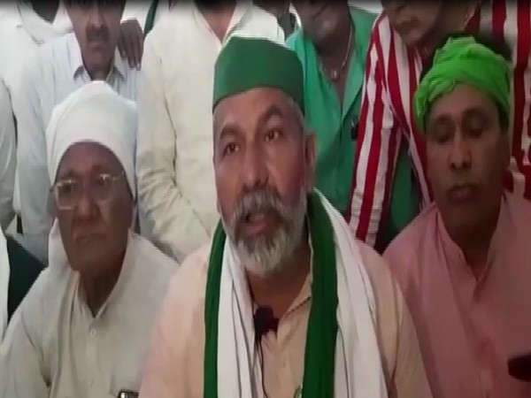 Bharatiya Kisan Union leader Rakesh Tikait speaks to reporters in Shamli on Sunday. [Photo/ANI]