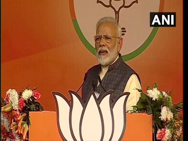Prime Minister Modi addressing an election rally at Karkardooma in Delhi on Monday.