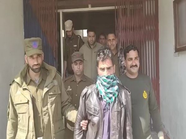 Officials with the Pakistani national who was apprehended in the forward area of Balakot sector. Photo/ANI