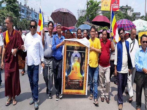Members of All India Buddhist Forum taking part in the peace rally at Siliguri on Sunday. Photo/ANI 