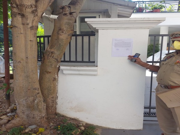 Summons had to be pasted outside the residence of Saini on the gate due to his non-availability. [Photo/ANI]