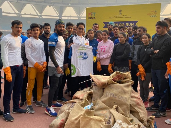 Union Minister Kiren Rijiju with plogging volunteers at Jawaharlal Nehru Stadium in Delhi [Photo/ANI]