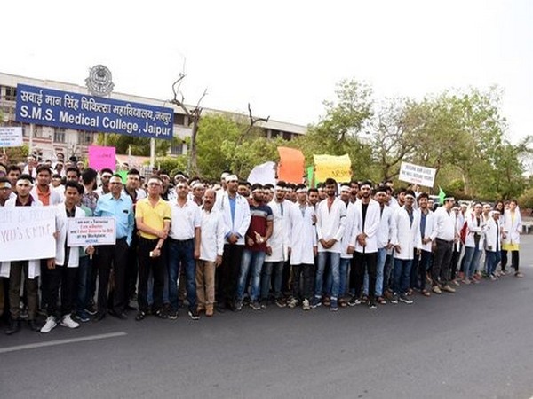 Medical staff protests against an alleged attack on a doctor in West Bengal, in Jaipur on Sunday. (ANI Photo)