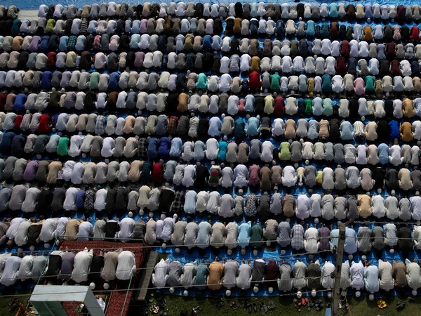 Muslim devotees offering prayers on the occasion of Eid al-Adha in Srinagar on Monday. Photo/ANI