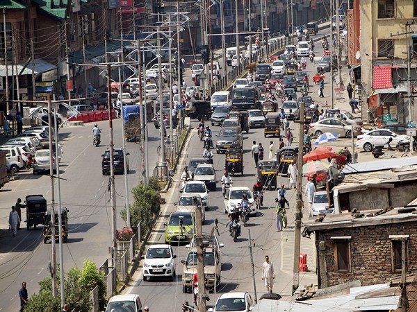Vehicular movement on a busy road in Srinagar on Tuesday. Photo/ANI