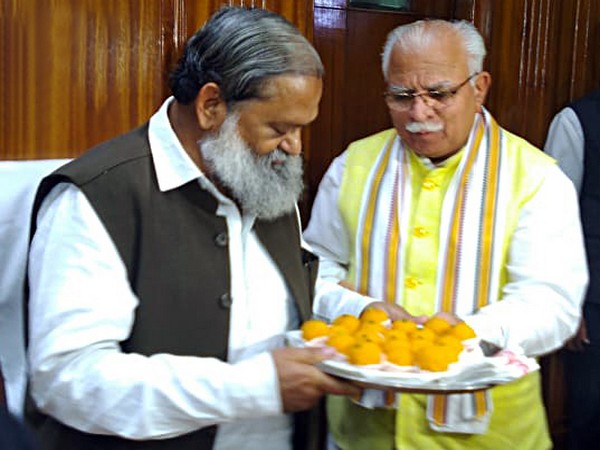 Senior BJP leader and Minister Anil Vij being greeted Chief Minister Manohar Lal Khattar in the Civil Secretariat, Chandigarh on Friday. Photo/ANI