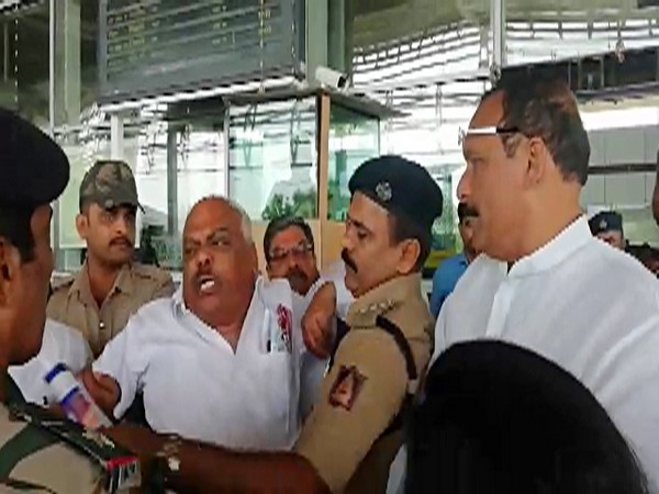 Former Karnataka assembly speaker KR Ramesh Kumar being detained after permission denied for former Karnataka Chief Minister K Siddaramaiah's charter flight to land in Mangaluru. [Photo/ANI]