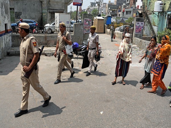 A photo of police personnel on Monday visiting site where violence erupted in Jahangirpuri on April 16. (Photo/ANI)