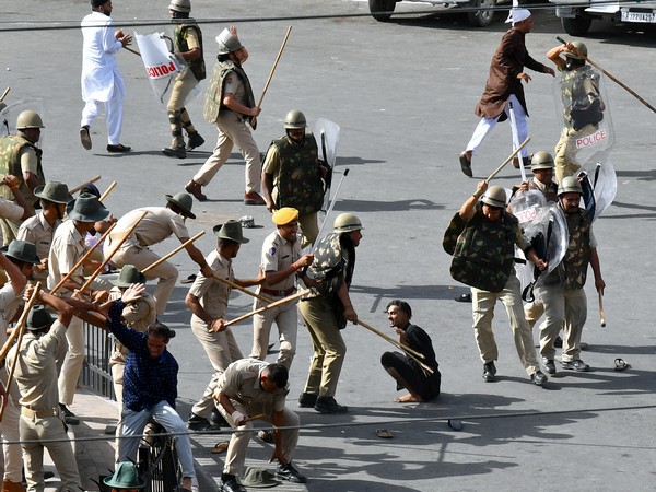 Police baton charge protesters after clashes broke out between two communities, in Jodhpur on Tuesday. (Photo/ANI)