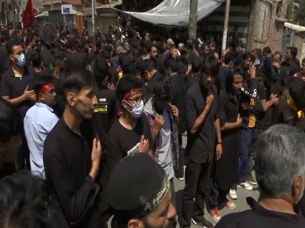 People participate in a Muharram procession in Srinagar on Thursday. [Photo/ANI]