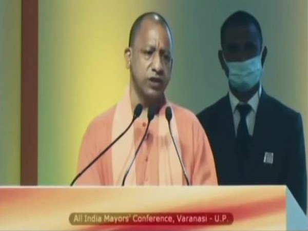 Uttar Pradesh Chief Minister Yogi Adityanath addressing All India Mayors' Conference in Varanasi on Friday. [Photo/ANI]
