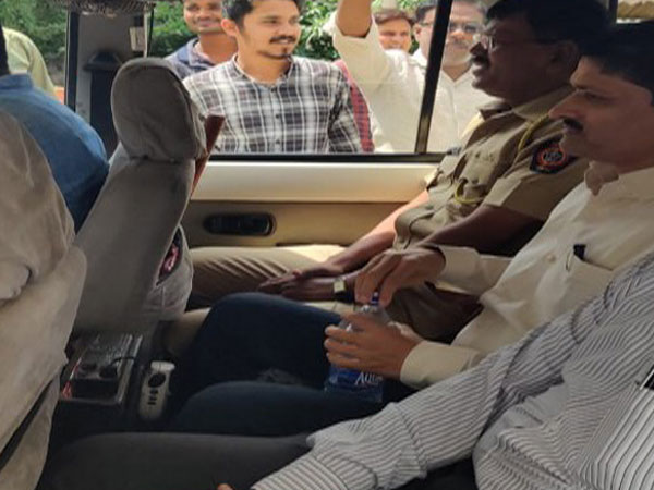 BJP MLA Charan Waghmare with the police on Wednesday in Nagpur. Photo/ANI