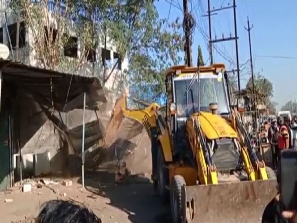 Indore district administration demolishes restaurants and dhabas selling illicit liquor on Monday. [Photo/ANI]