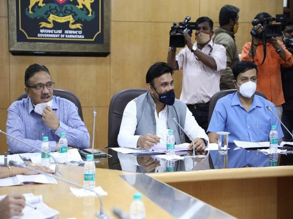 Karnataka health minister Dr K Sudhakar (Centre). (Photo/ANI)