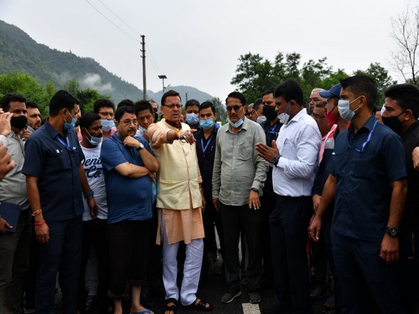 CM Pushkar Singh Dhami with the locals at the spot. (Photo/ANI)