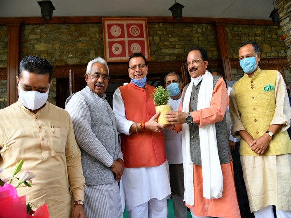 Ajay Bhatt and Pushkar Singh Dhami in Dehradun. (Photo/ANI)