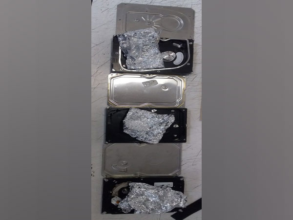 Amphetamine drugs being recovered from hard disk.