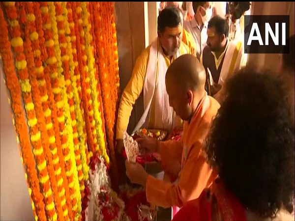 UP CM Yogi Adityanath installing the idol at the Kashi Vishwanath Temple in Varanasi on Monday. (Photo/ANI)