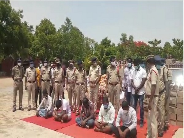 Chittor Police with seized liquor and arrested accused (Photo/ANI)