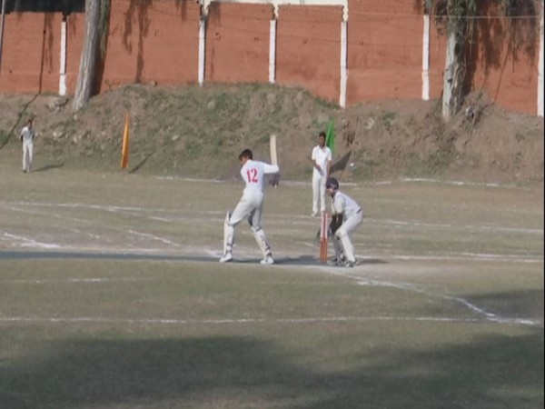 Players in action during under-19 cricket tournament organised in Rajouri. [Photo/ANI]