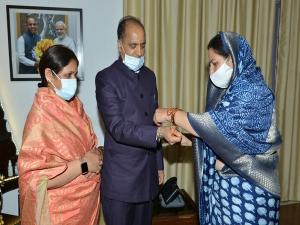 HP CM being tied Rakhi by President BJP Mahila Morcha Rashimi Dhar Sood and other members of Morcha on occasion of Raksha Bandhan at Oakover, today