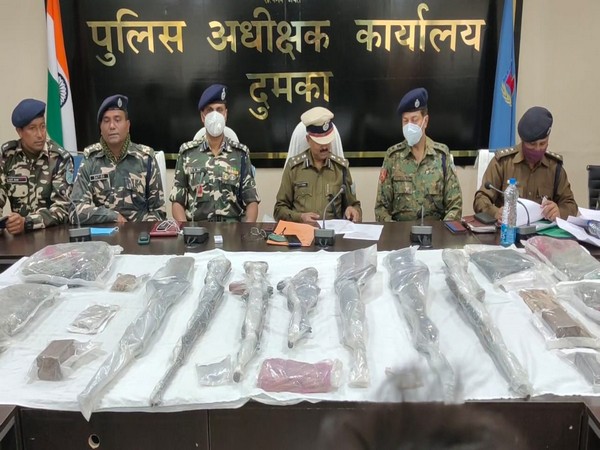 Security forces with the seized consignment in Dumka
