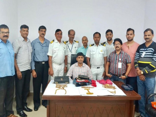 Goa Air Customs officials with the seized gold in Panaji on Sunday. Photo/ANI