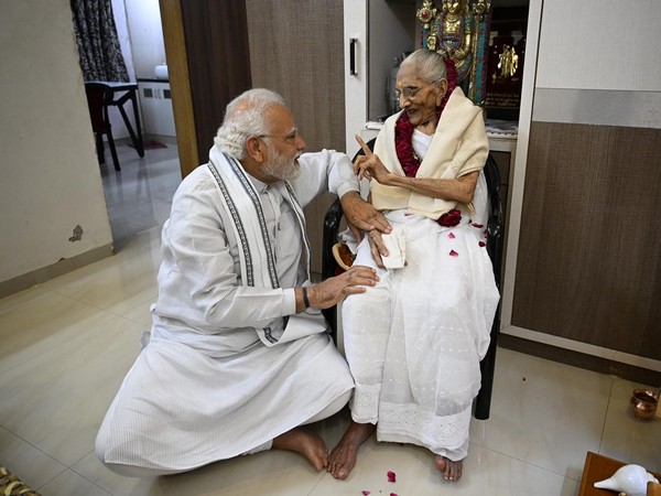 Prime Minister Narendra Modi with his mother Heeraben Modi at her residence in Gandhinagar on Saturday. (Photo/ANI)