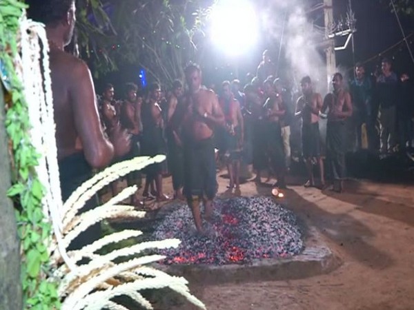 Ayyappa devotees walking on fire bed as a part of the rituals in Karnataka on Friday night. Photo/ANI