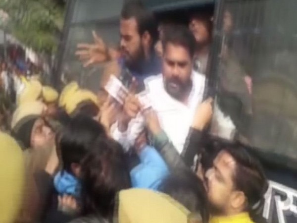 Police detaining demonstrators who held a protest outside JK Lon Hospital in Kota on Friday. Photo/ANI