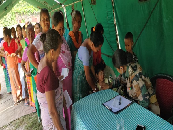 Locals being attended by army doctors in Chirang on Saturday. Photo/ANI