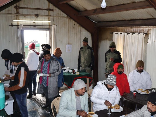Image shows rescued tourists having after rescue in Gulmarg. (Photo/ANI)