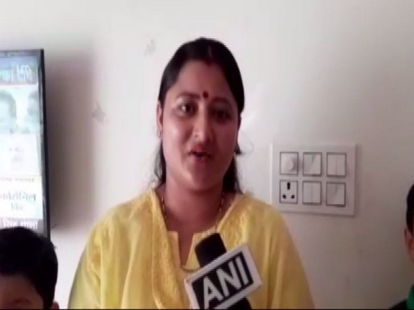Uttarakhand Chief Minister-elect Pushkar Singh Dhami's wife Geeta Dhami speaking to ANI in Khatima on Saturday. [Photo/ANI]