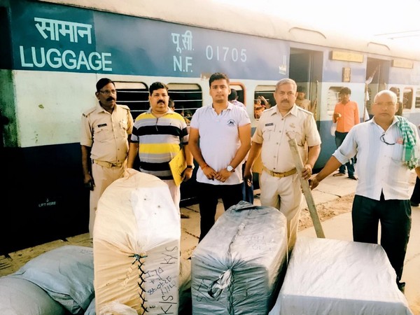 Police with illegal cache at the Charbagh station on Saturday. Photo/ANI