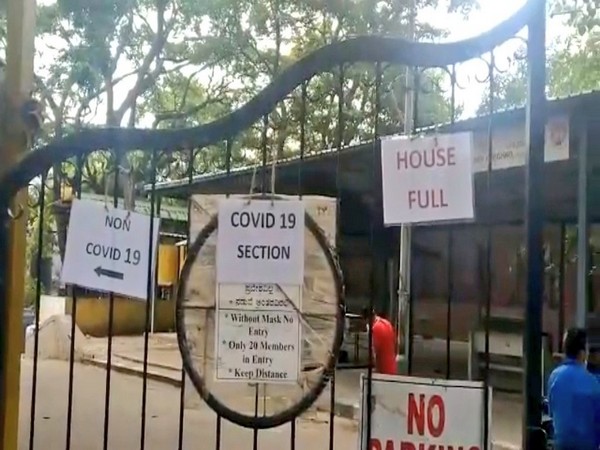 'Housefull' board displayed outside the Chamrajpet Crematorium gate. (Photo/ANI)
