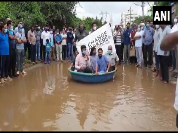 Citizens offer boat rides for Rs 20 in Bengaluru's Anjanapura roads. (Photo/ANI)