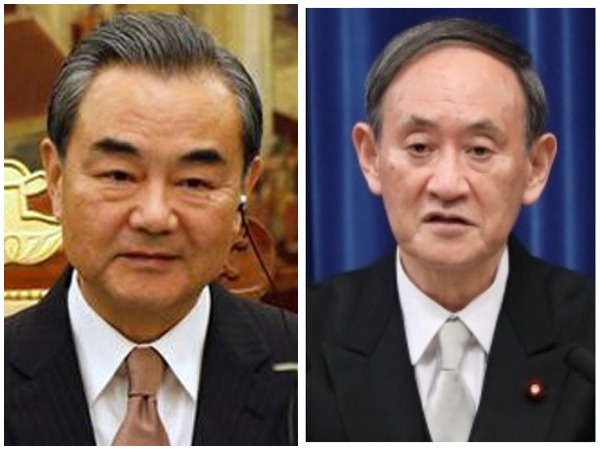    Chinese Foreign Minister Wang Yi and Japanese Prime Minister Yoshihide Suga 