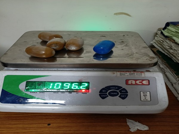 The compound gold was in five capsule-shaped packets concealed in the rectum of the passenger.